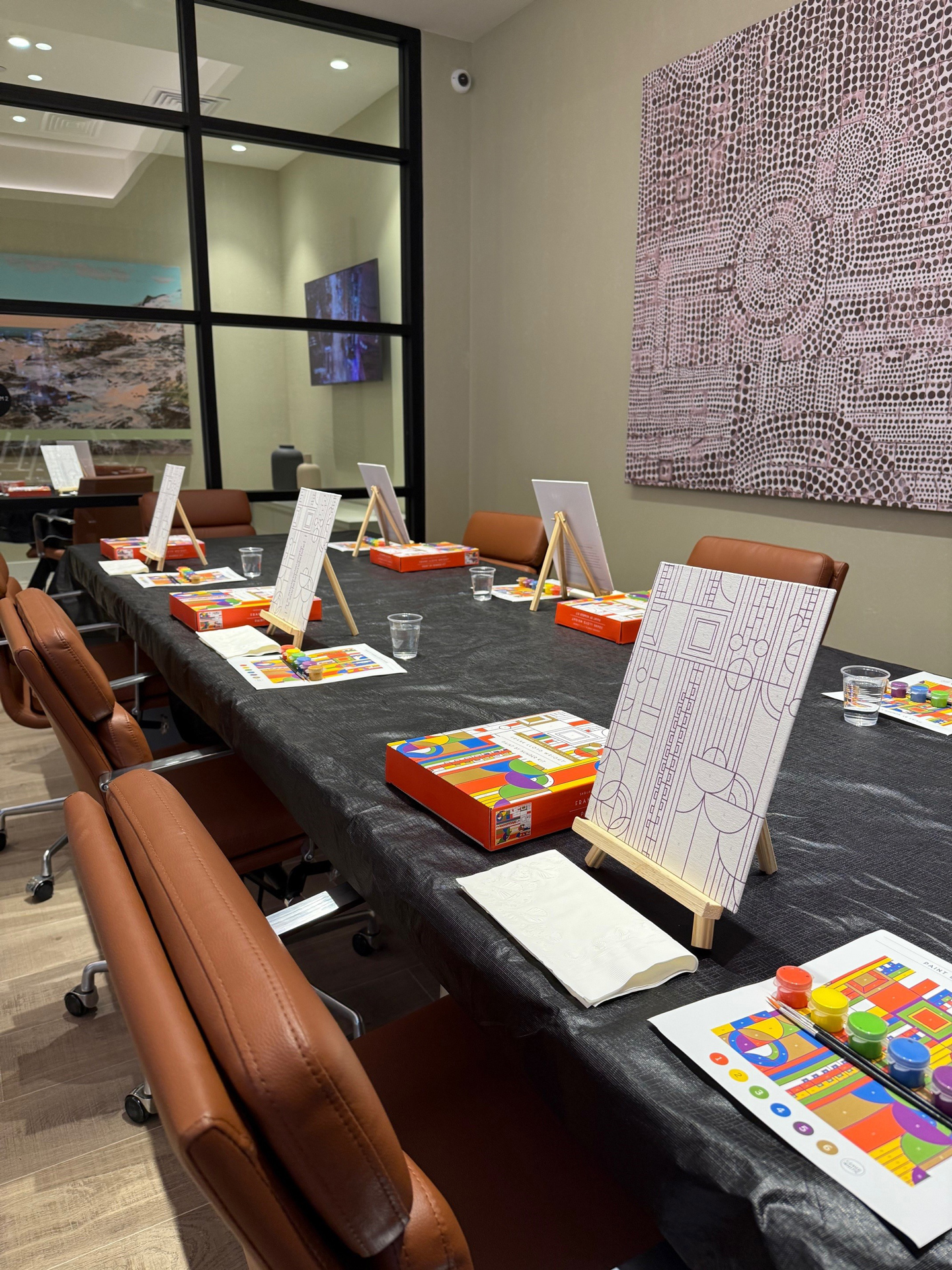 Sip & paint night with canvases and easels in the resident lounge at Town Chandler apartments in Chandler, AZ.