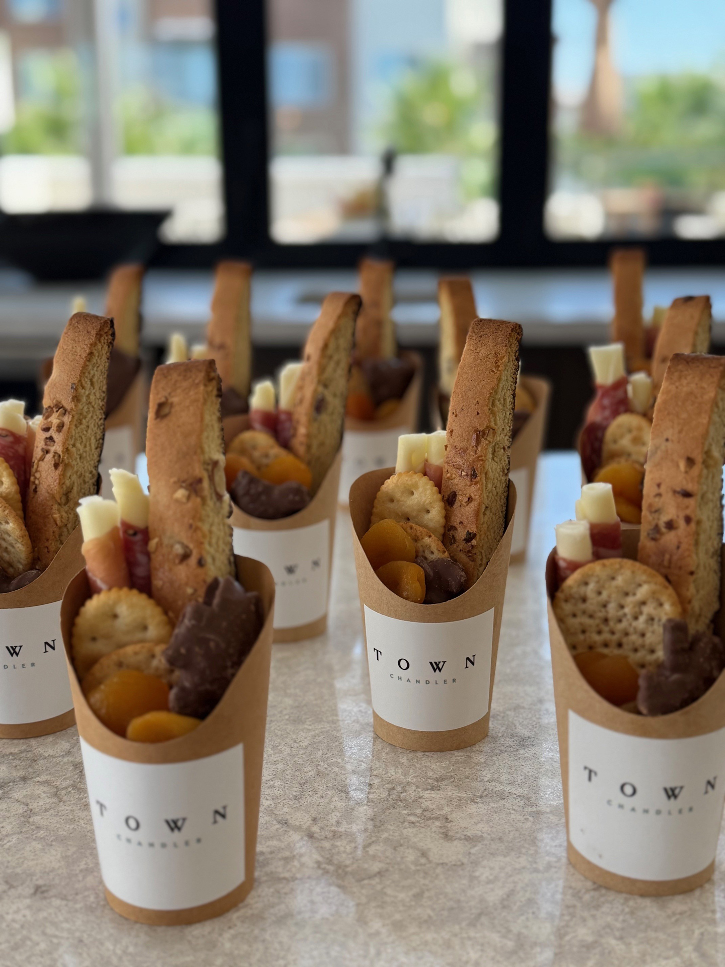 Town Chandler–branded charcuterie cups at a resident event at Town Chandler luxury apartments in Chandler, AZ.